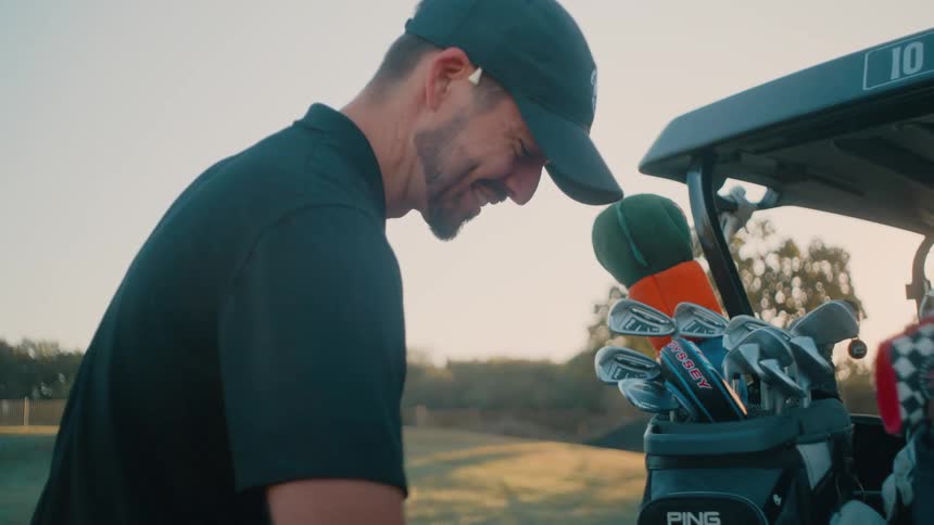 A couple men playing golf