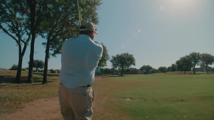 A man playing golf
