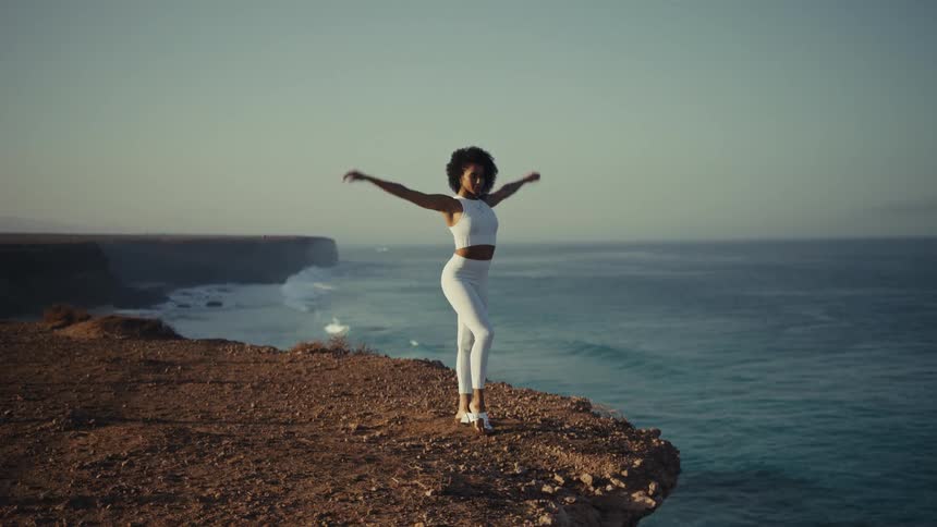 A woman doing yoga on a sunny day