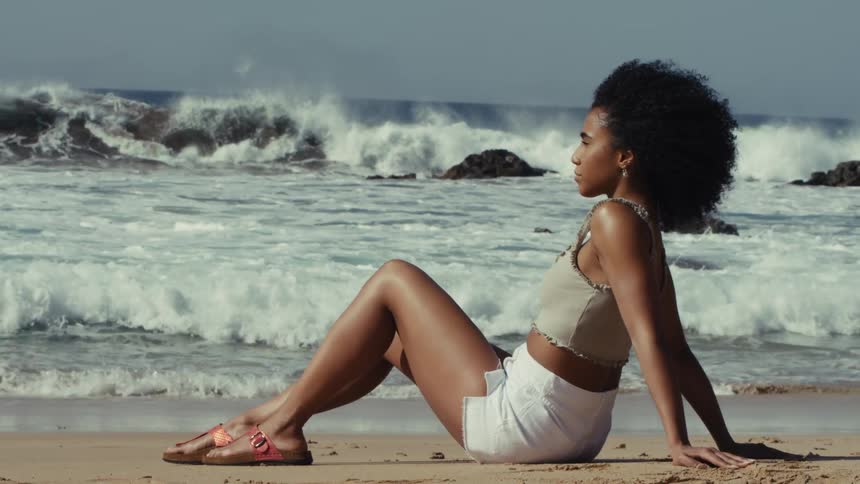 A woman resting on a beach