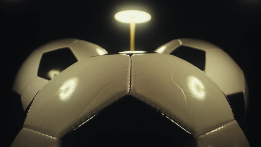 Soccer balls in an indoor space with light