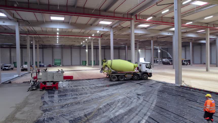 Construction workers working in a warehouse