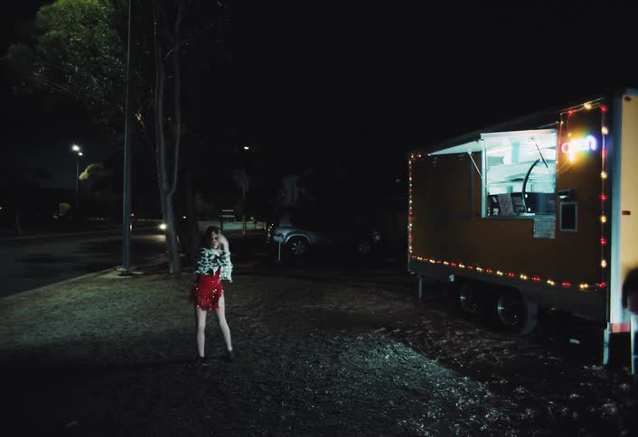 A child dancing outdoors at night