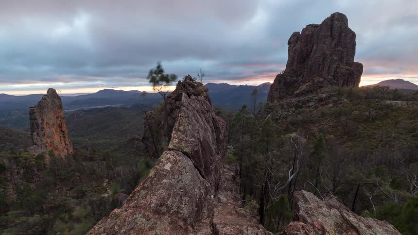 A time lapse of a sunset over some rocks