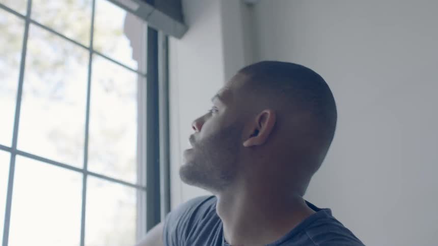 A man wipes down a window