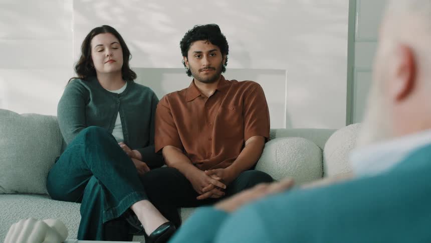 The therapist is speaking with his patients