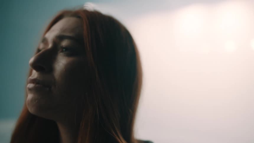 The sad woman closes her eyes