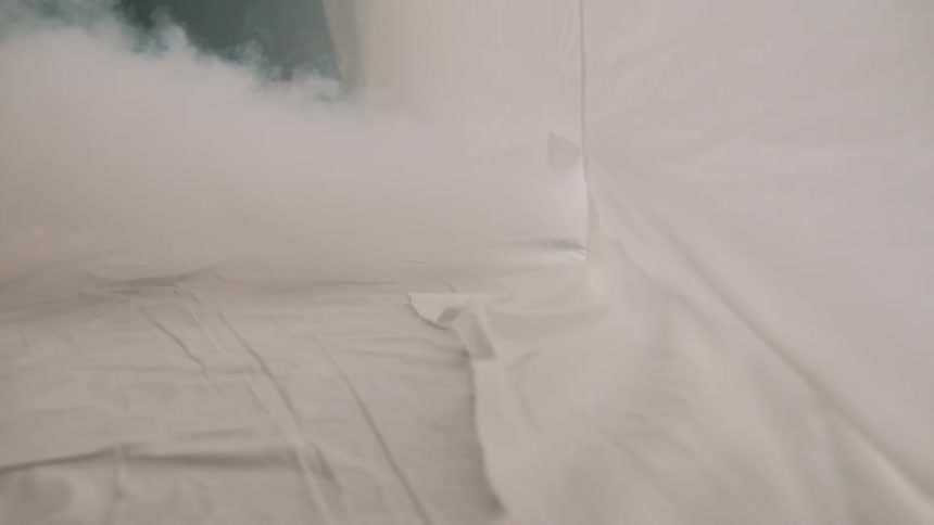 A room is being fumigated with thick smoke filling the enclosed space