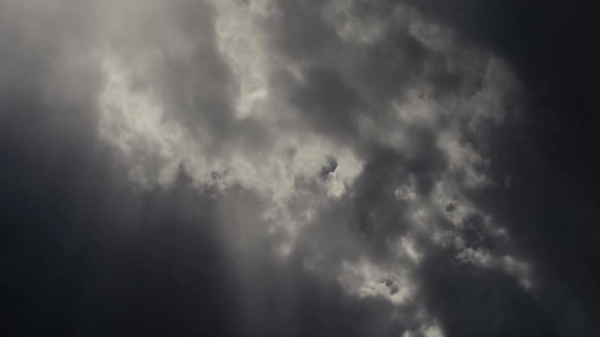 Sunlight shines through the dark clouds