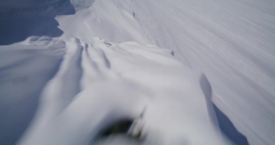 Flying down a mountain covered in snow
