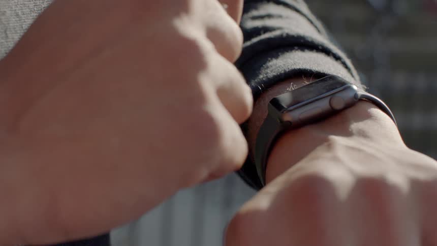 A man checks his watch