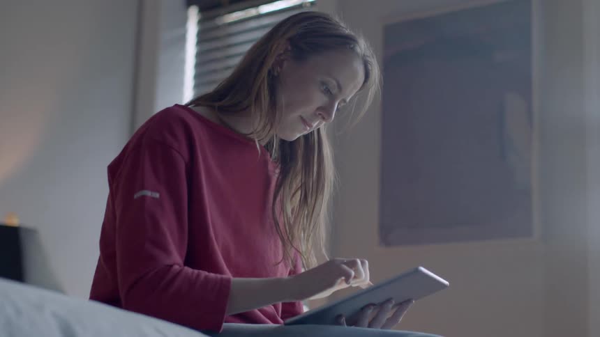 A woman is using a tablet