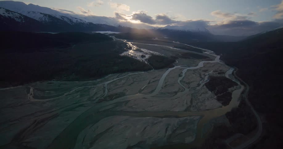 An aerial view of a river with moutains
