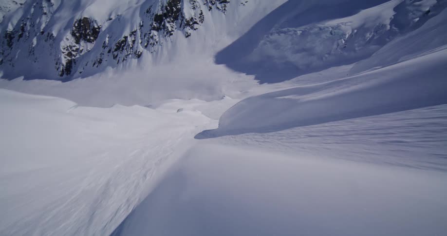 The white snow covers the steep mountain