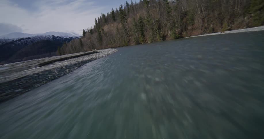 The stream is covered with ice in the wilderness