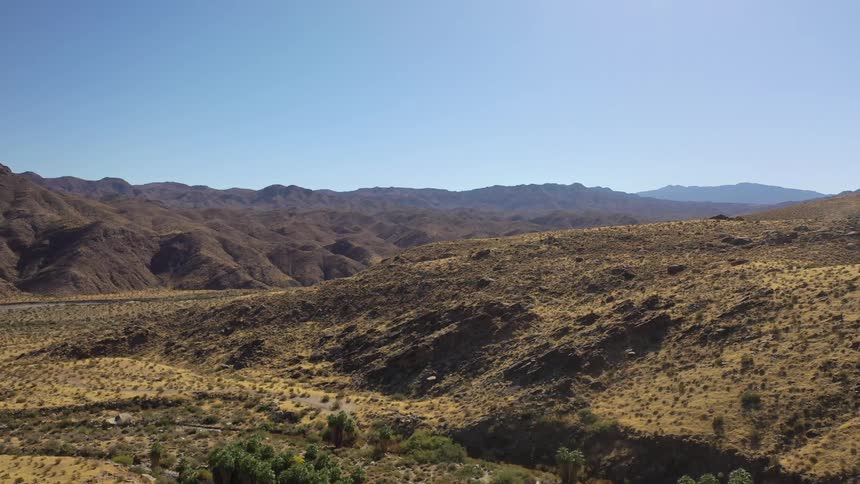 The badlands are covered with shrubs and hills