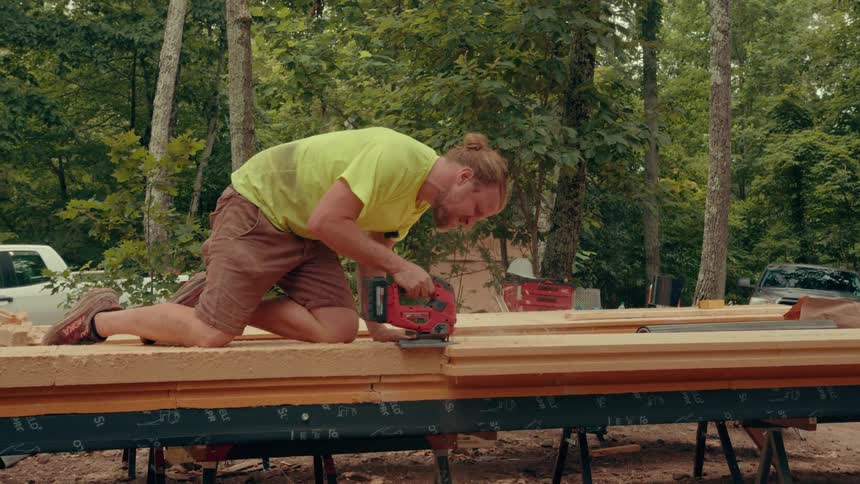 A construction worker working with a saw