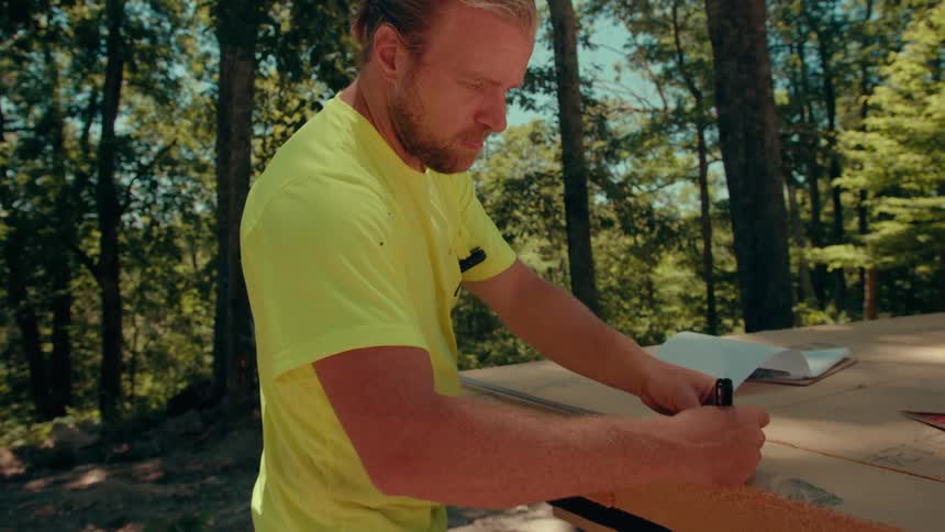 Engineer working on a construction site in a forest