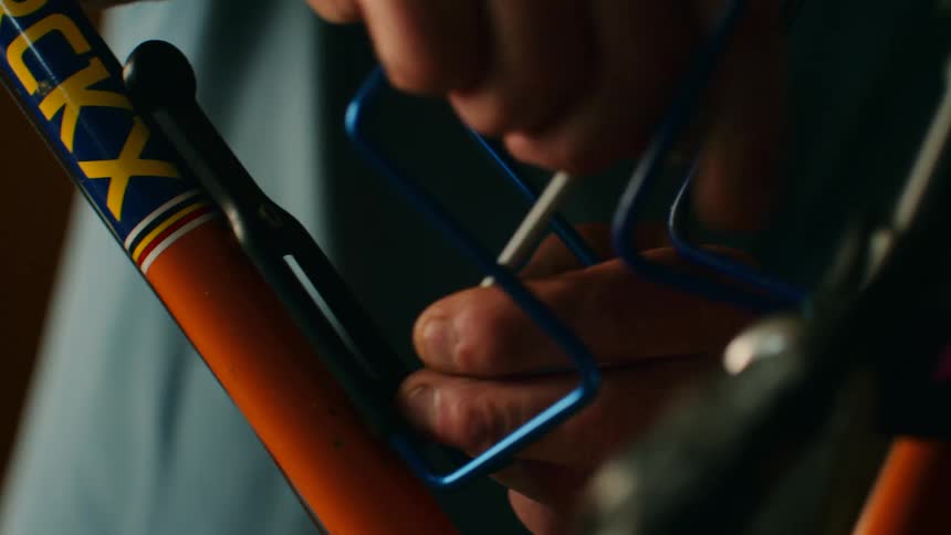 A person assembling a bicycle