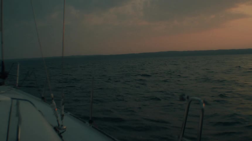 Sailing boat at sea in the late afternoon