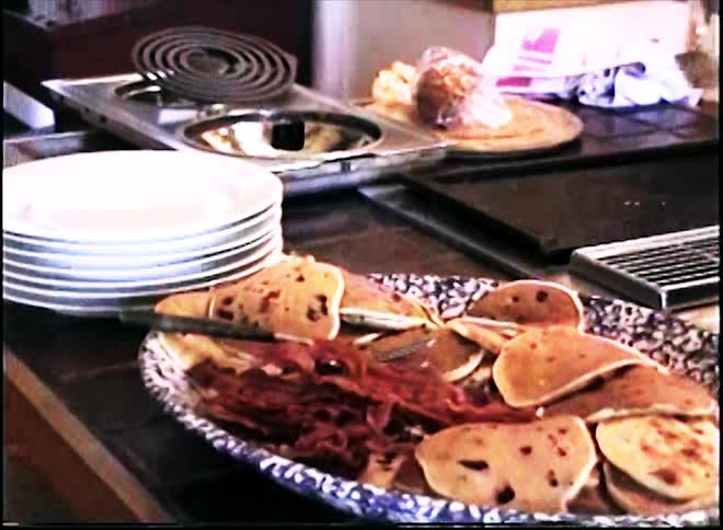 The person is using the spatula in the kitchen