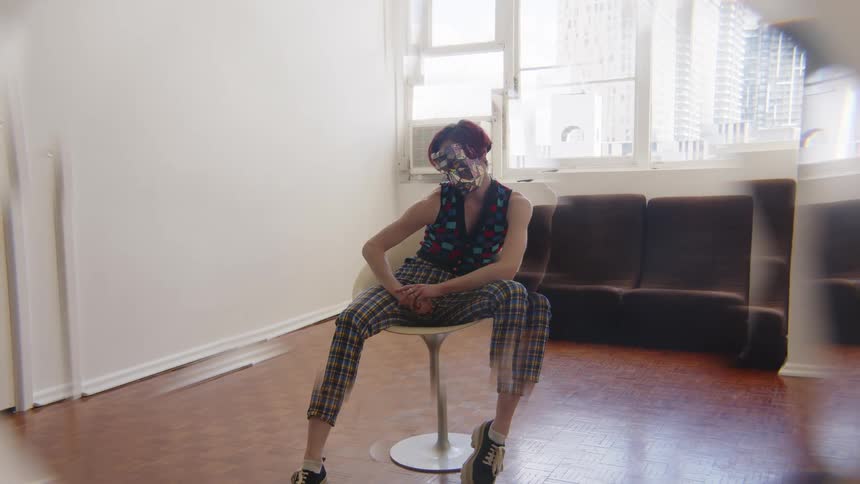 A woman sitting in a chair in a room