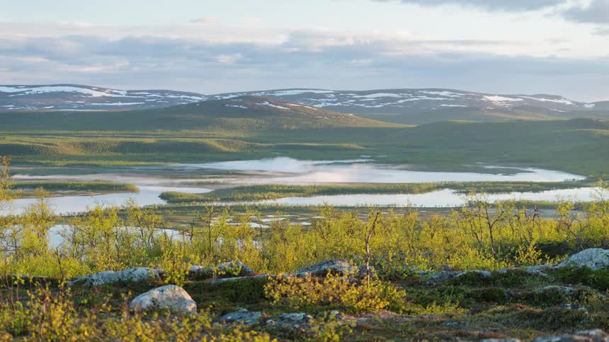 Clouds float over mountains in the North Finland wilderness
