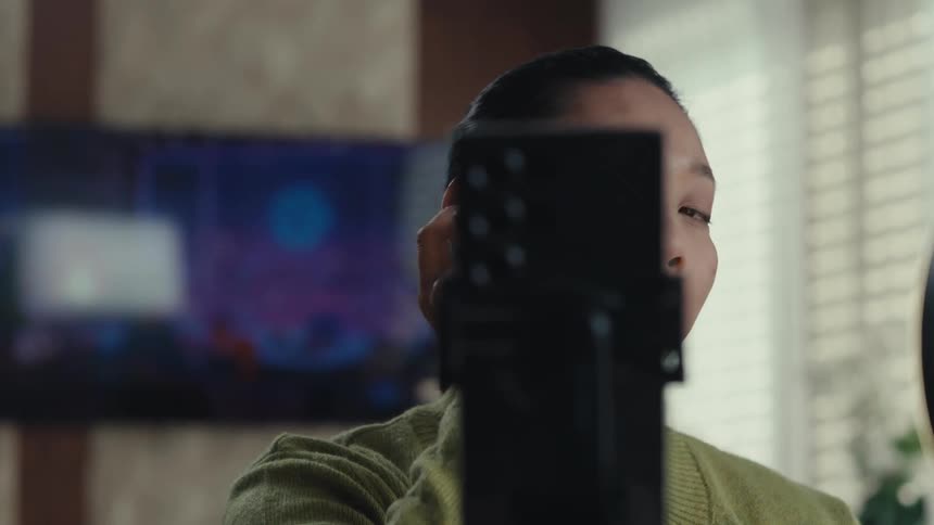 The woman is applying makeup with a pad