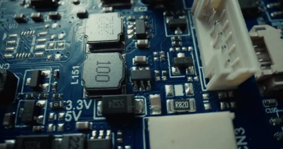 The computer board is blue and covered with sockets