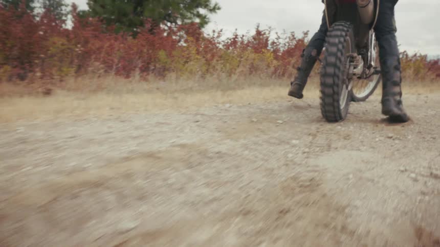 A man riding a dirt bike outdoors