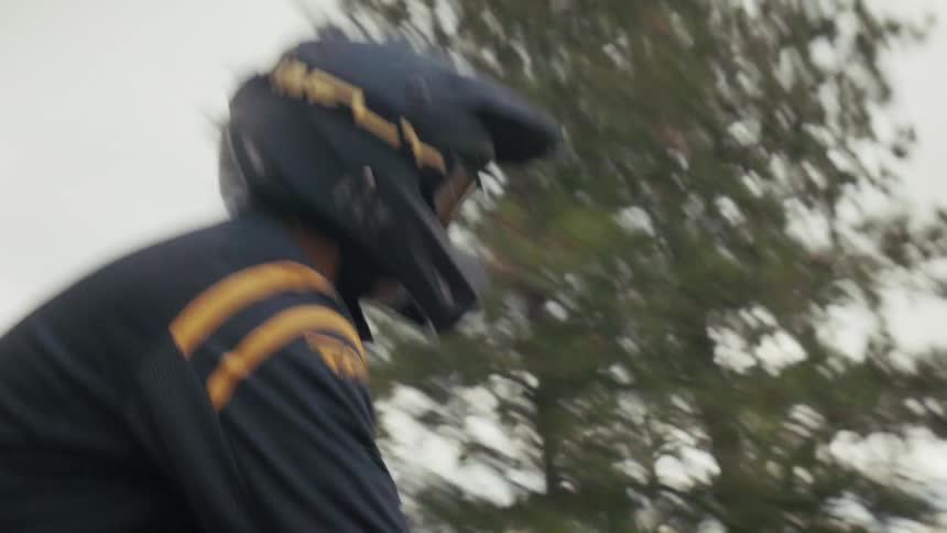 The man bounces as he rides on his dirt bike