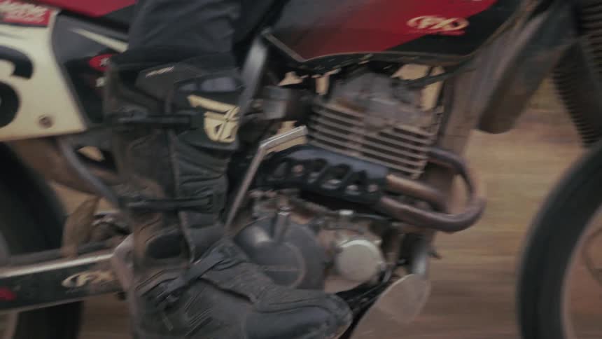 A person riding a dirt bike outdoors