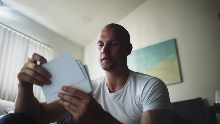 A man looks through photographs