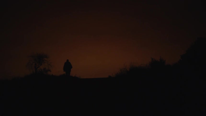 Man running in the wilderness in the dark