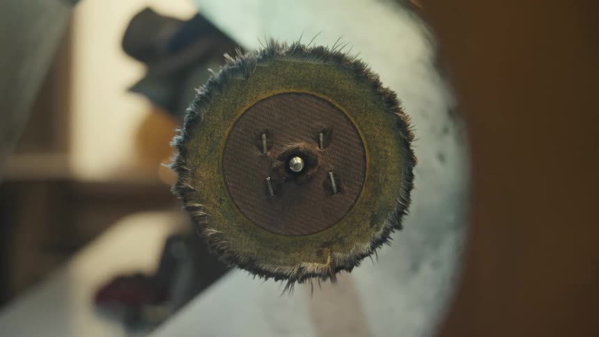A felt polishing wheel in a factory