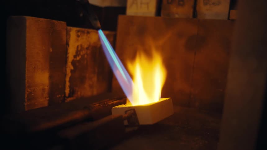 A torch heating metals inside a workshop
