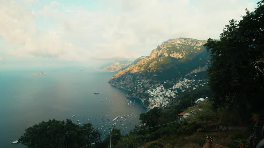 Boats are docked by the shore of the island