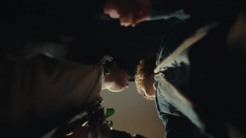 A man and woman about to kiss each other
