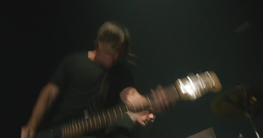 Two musicians are playing in a band