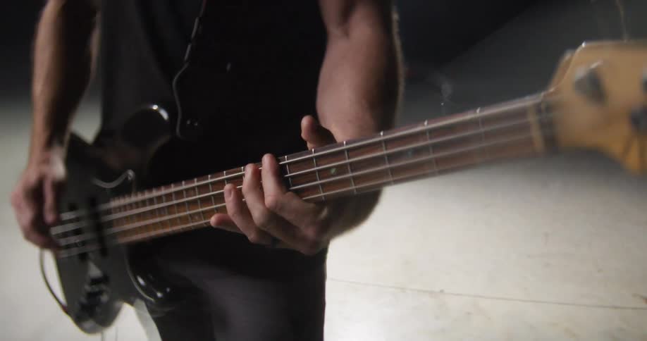 A man playing bass on a stage
