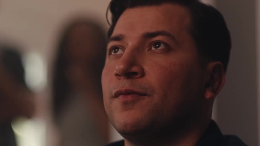 The man blinks while watching something