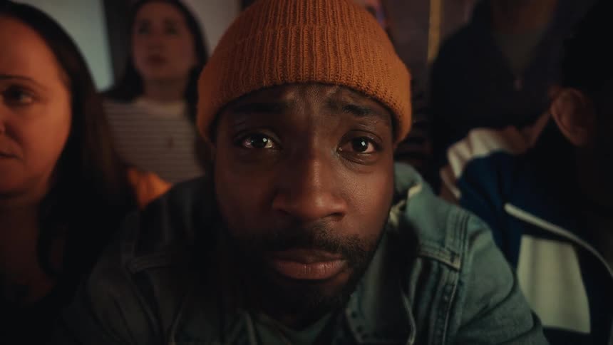 A group of people in a room watching something