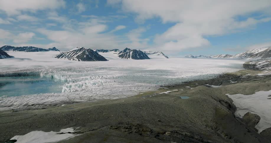 Snow covered ice and mountains on the arctic coast