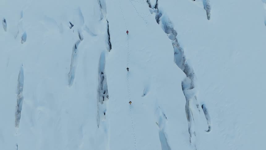 A few people hiking in the snow