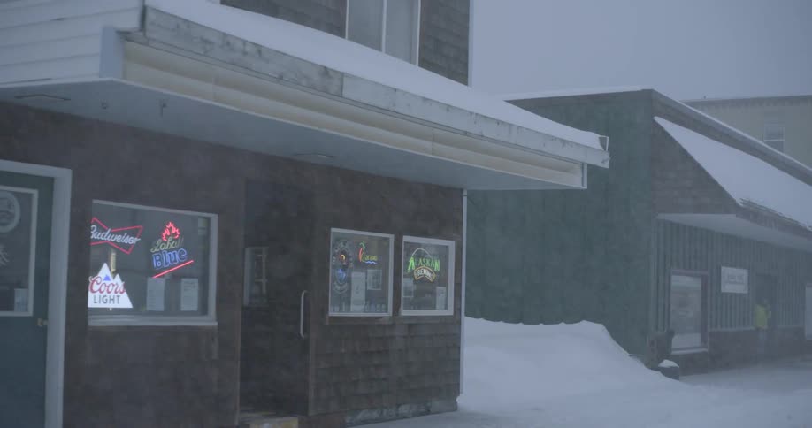 Snowcovered storefront during a winter storm