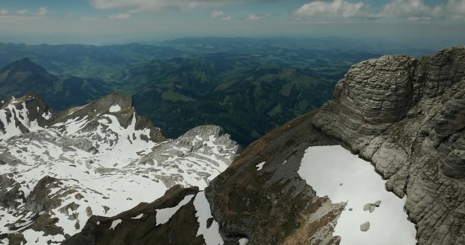 Melting snow is at the upper elevations in a mountain range