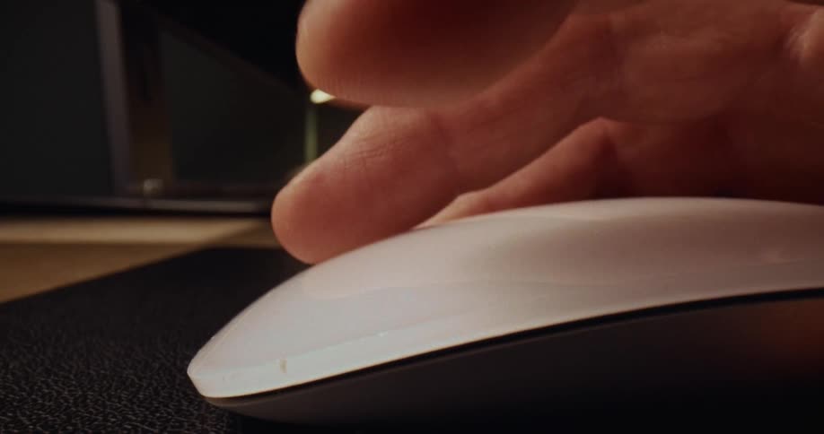 A close up of a person using a mouse