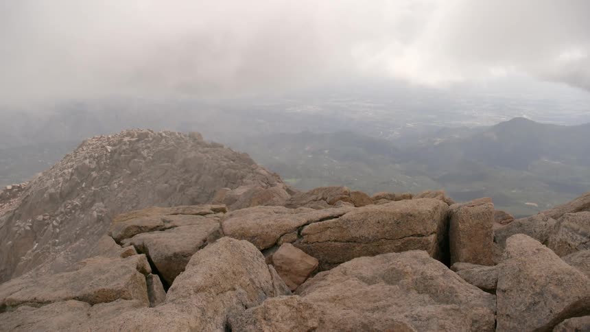 The fog rolls over the mountain top