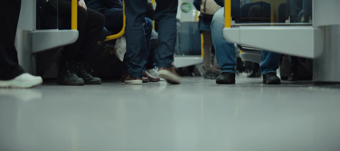A group of people getting on a train