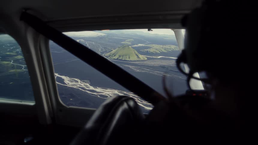 Wind blows the pilots hair as she flies